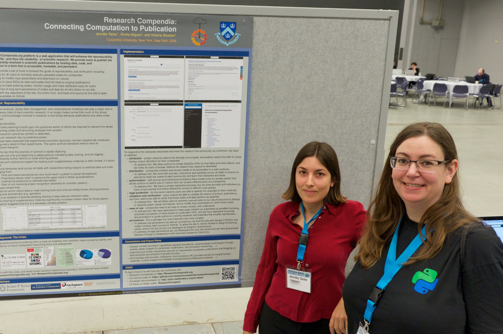 two people standing in front of a poster at PyCon 2014